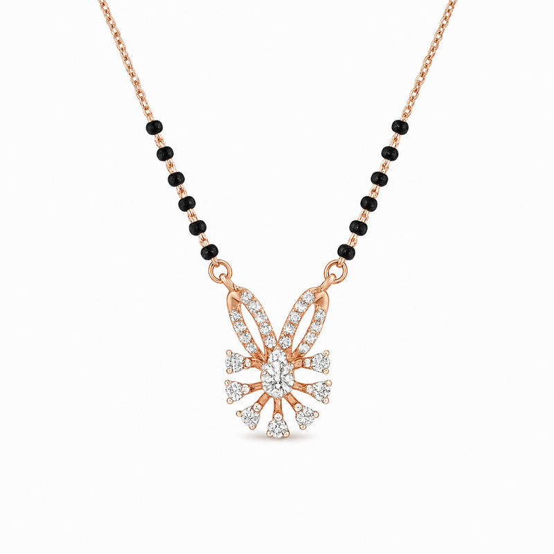 Elegant rose gold mangalsutra necklace featuring black beads and a sparkling floral-inspired diamond drop pendant with intricate detailing on a white background.