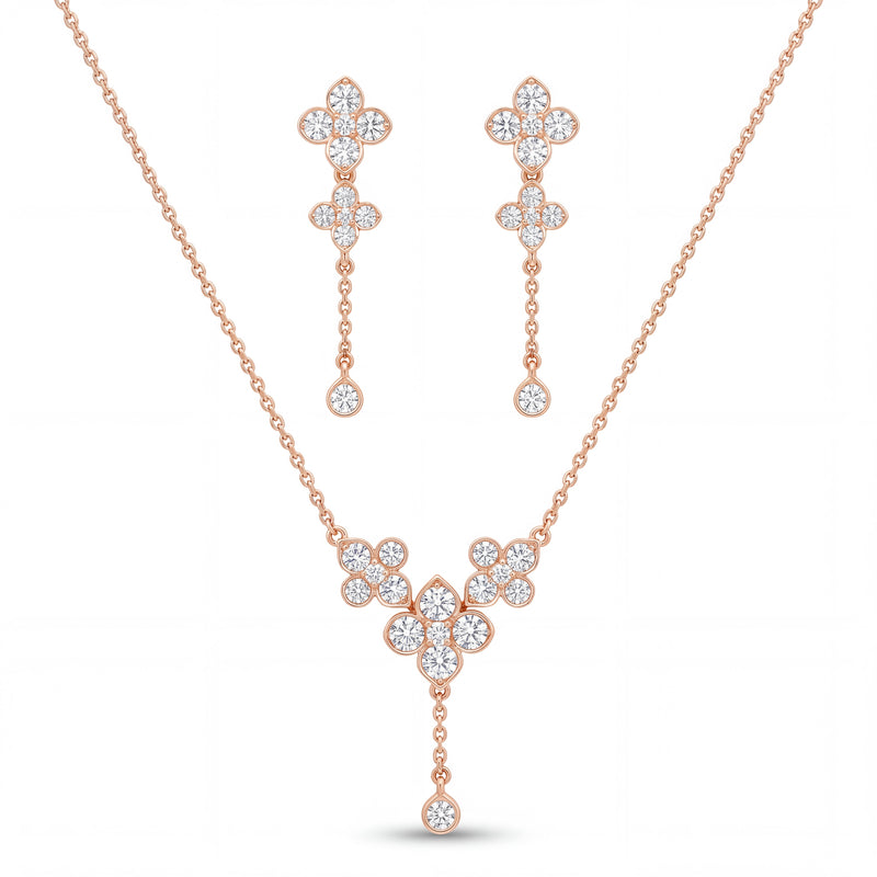 Elegant rose gold diamond jewelry set featuring a floral drop pendant necklace with matching dangling floral earrings on a white background.