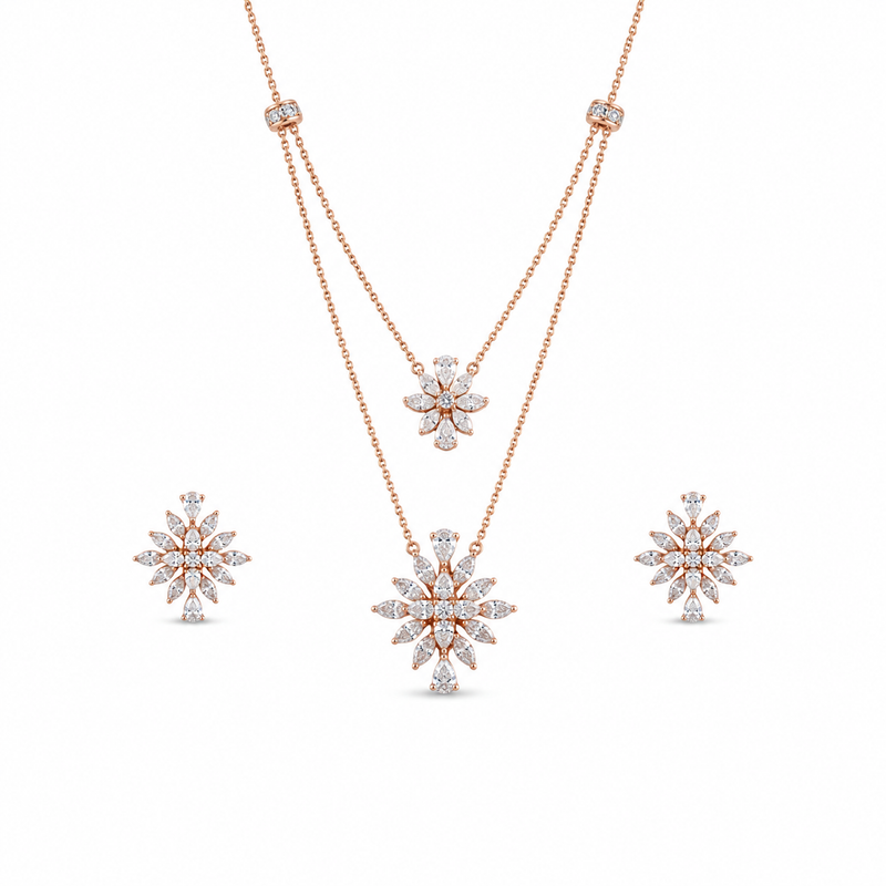 Elegant rose gold diamond jewelry set featuring a layered floral pendant necklace and matching floral stud earrings on a white background.