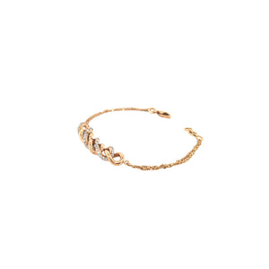 Elegant rose gold bracelet featuring intertwined infinity-style links adorned with sparkling diamond accents on a delicate chain with an adjustable clasp.