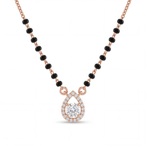 Elegant rose gold mangalsutra necklace featuring black beads and a sparkling teardrop-shaped diamond pendant with halo detailing on a white background.