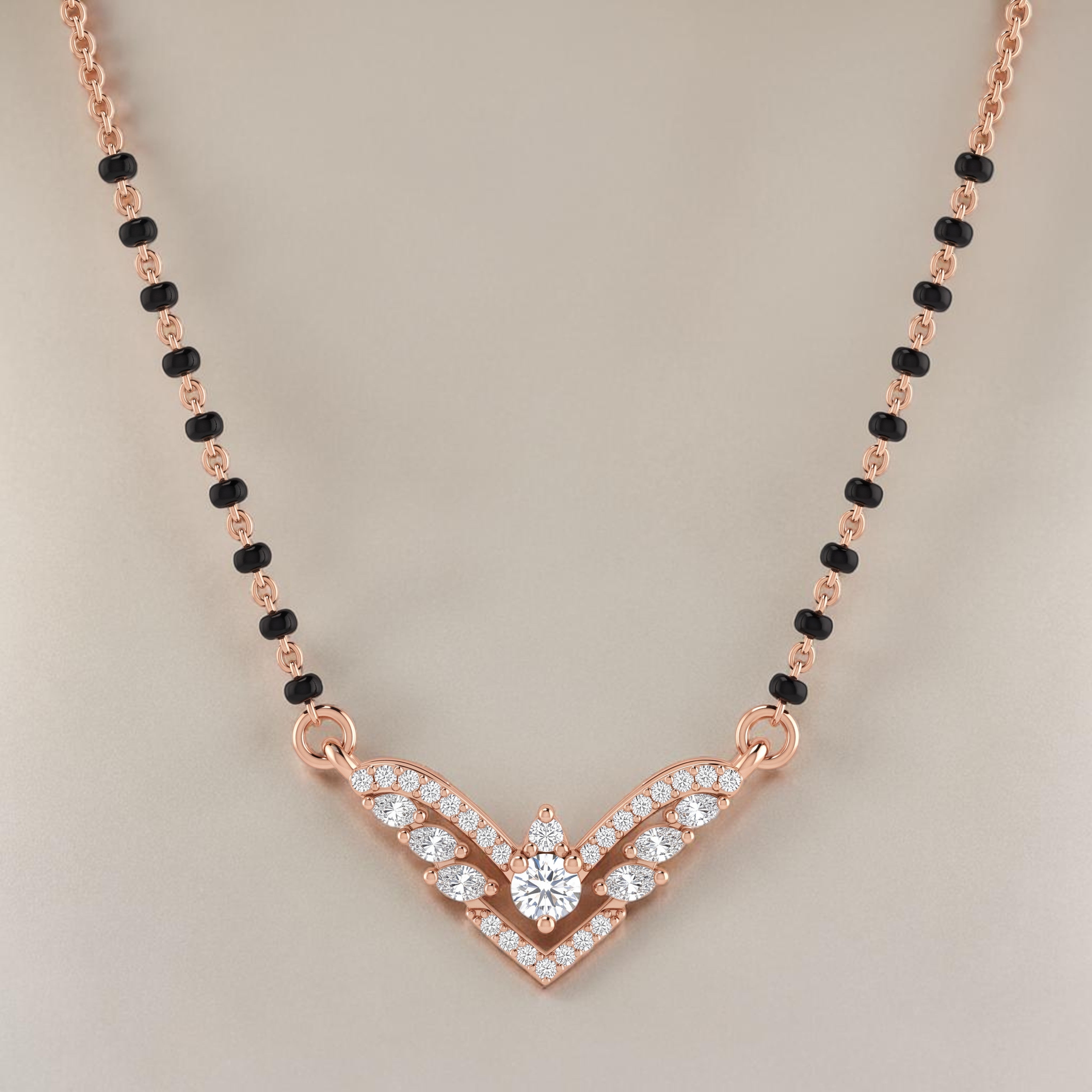 Elegant rose gold mangalsutra necklace featuring black beads and a sparkling V-shaped diamond pendant with wing-inspired detailing on a white background.