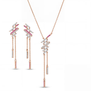Modern rose gold jewelry set featuring geometric diamond and pink sapphire accents with dangling bar details in a pendant necklace and matching earrings on a white background.