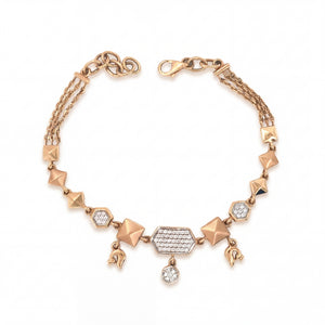 Stylish rose gold bracelet featuring geometric pyramid motifs, sparkling diamond accents, and dangling charm details with an adjustable chain clasp on a white background.