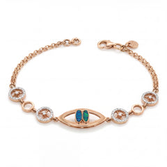 Stylish rose gold bracelet featuring an evil eye centerpiece with blue opal accents and sparkling circular diamond motifs on a delicate chain with adjustable clasp.