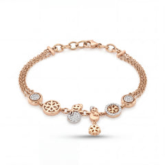 Elegant rose gold charm bracelet featuring snowflake motifs, sparkling diamond accents, and playful dangling charms on a multi-chain adjustable bracelet.