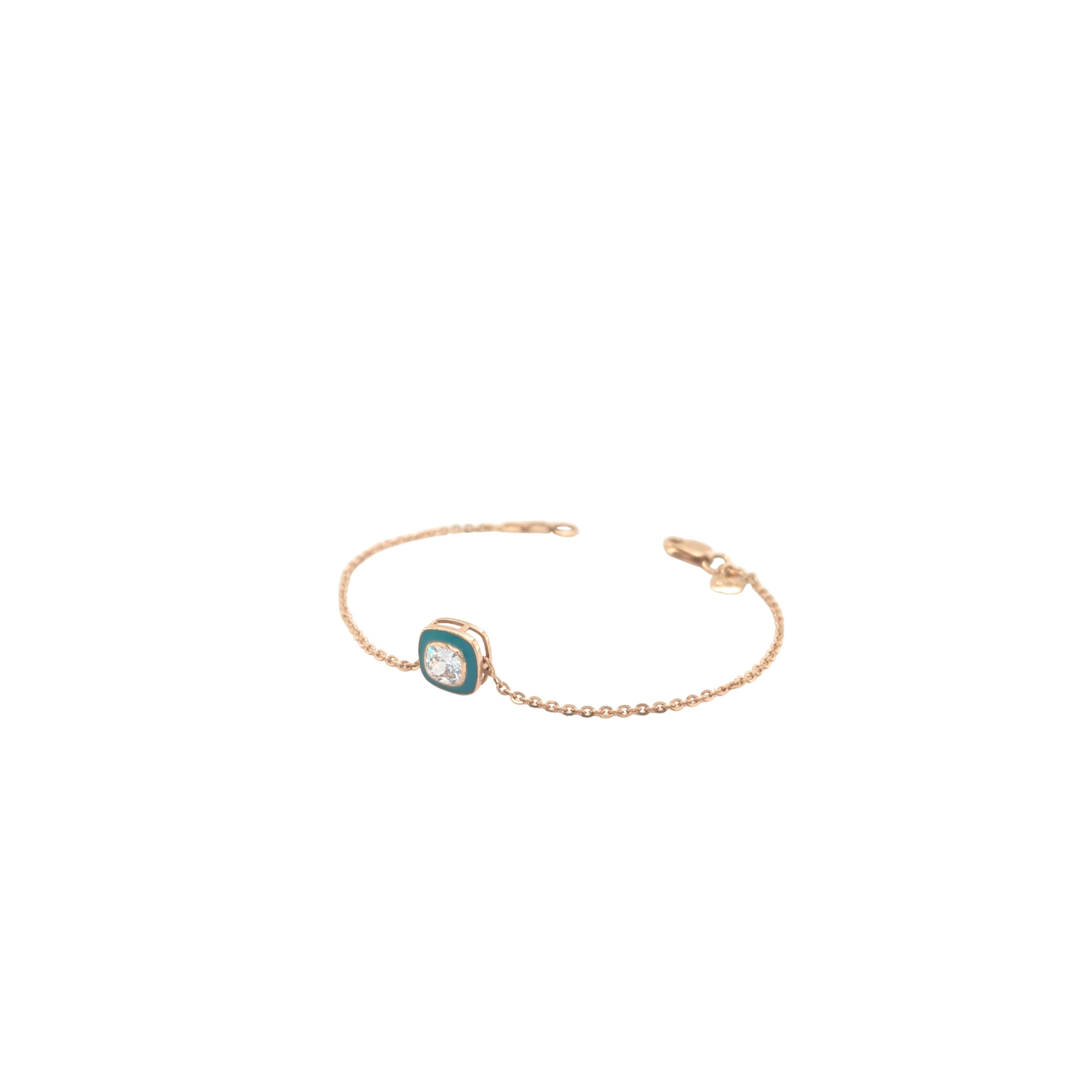 Elegant rose gold bracelet featuring a solitaire crystal centerpiece with turquoise enamel detailing on a delicate chain and adjustable clasp against a white background.