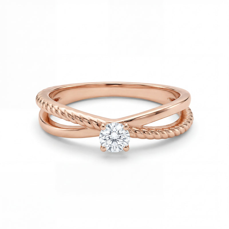 Rose gold ring with a diamond on a white background