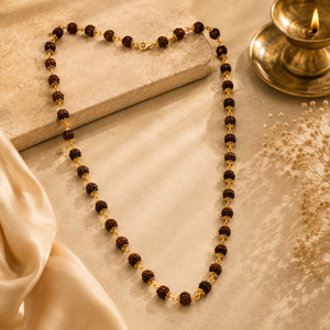 Traditional Rudraksha mala featuring multiple Rudraksha beads connected with delicate gold links and detailing, finished with a gold clasp.