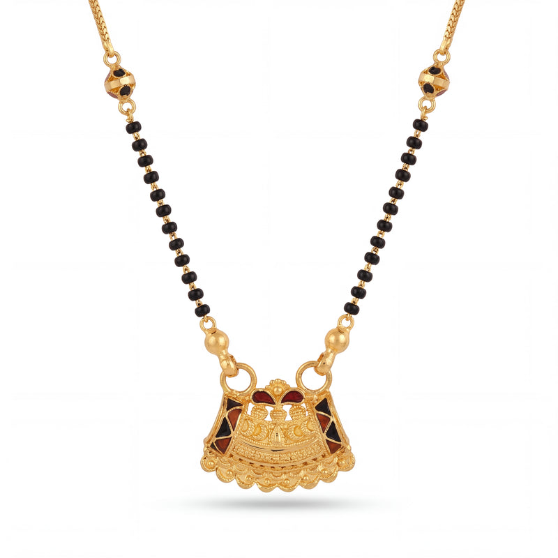 Elegant 22K gold mangalsutra necklace with black bead chain, decorative gold side beads, and ornate temple-inspired pendant with enamel detailing on a white background by Pachchigar Jewellers Ashokbhai.