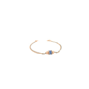 Elegant two-tone gold bracelet featuring a blue enamel centerpiece with textured gold beads on a delicate dual-chain design with adjustable clasp.