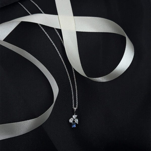Modern muse: Blue-accented Pendant Set with diamond sparkle And Studs Earring